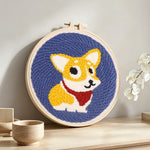 Cute corgi dog punch needle artwork displayed on a table