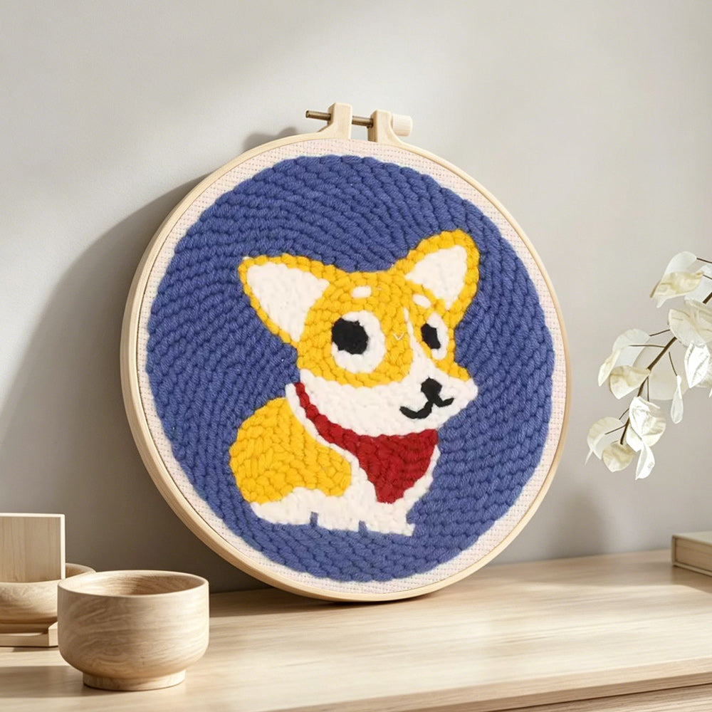 Cute corgi dog punch needle artwork displayed on a table