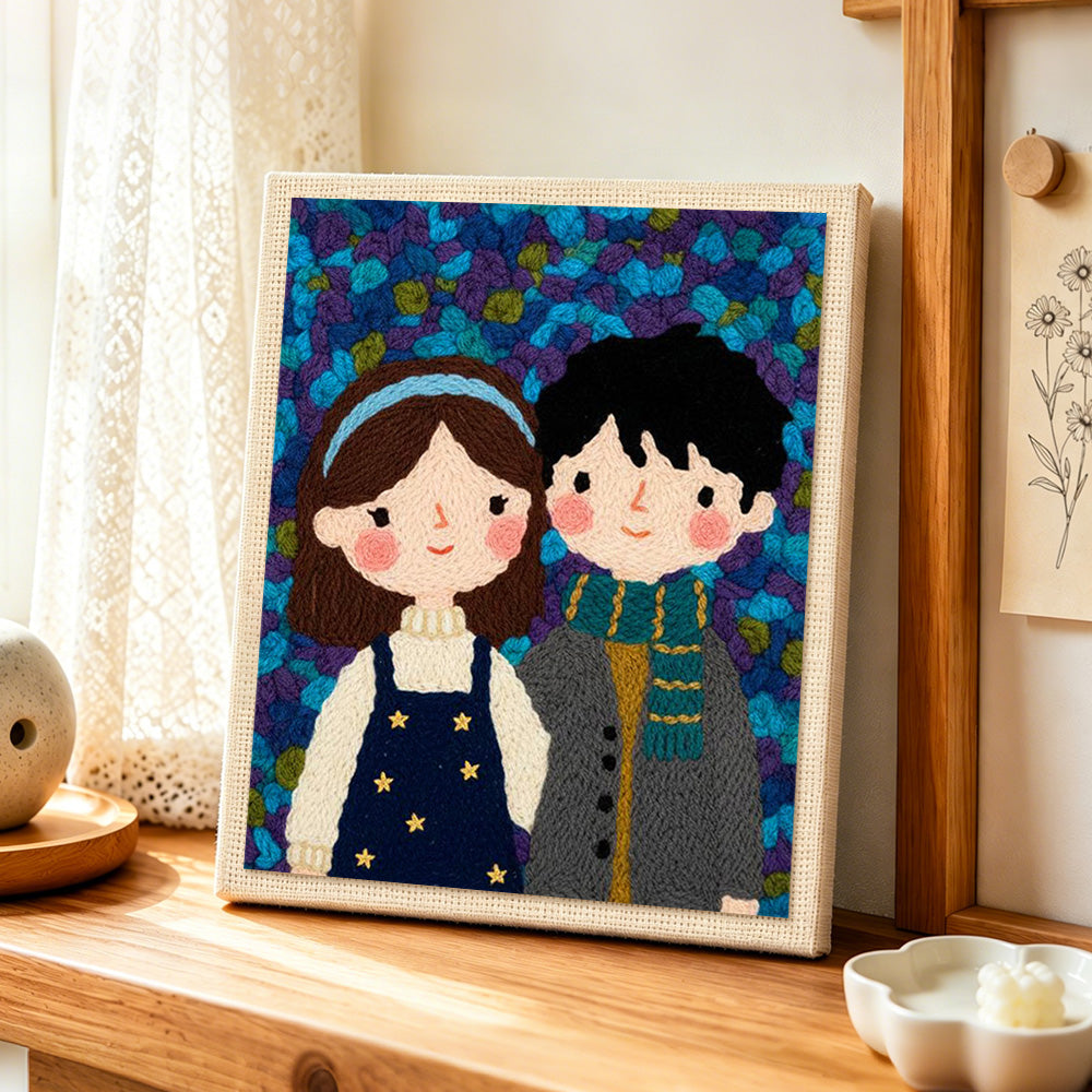 Cute couple and some flowers punch needle artwork displayed on a table