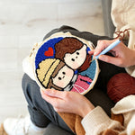 Creating handmade cute couple portrait with heart punch needle artwork