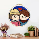 Finished cute couple portrait with heart artwork displayed on a wall