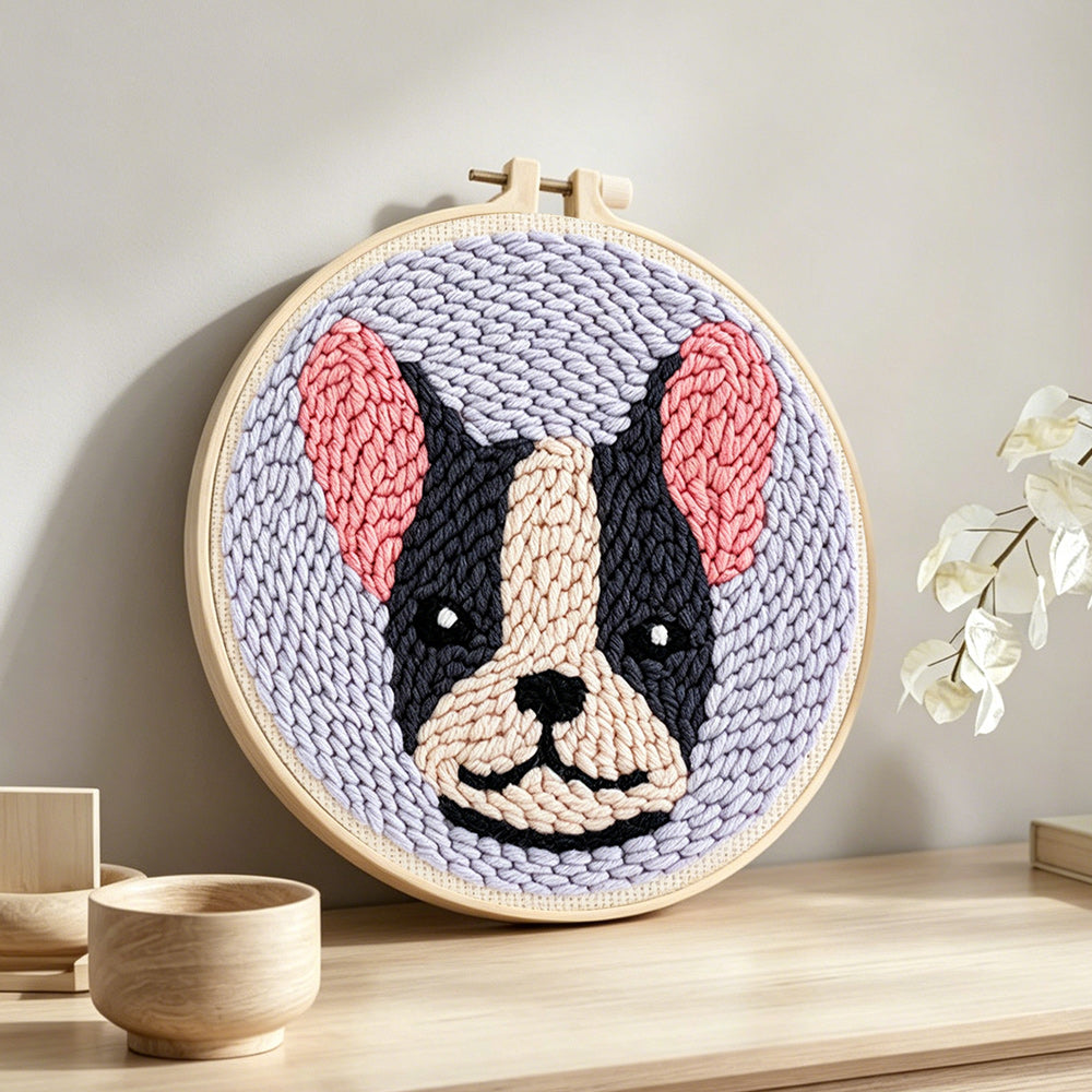 Cute dog punch needle artwork displayed on a table
