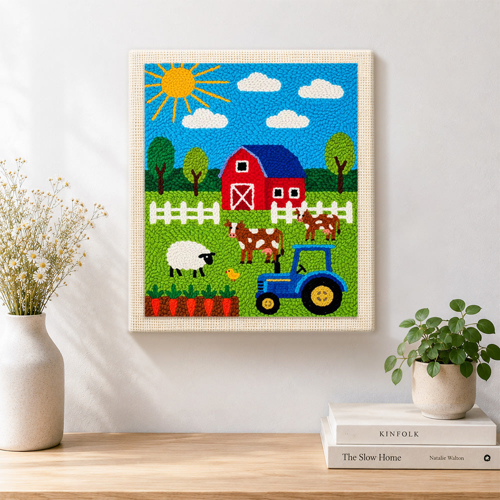 Finished fcute farmyard animals and tractor artwork displayed on a wall