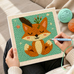 Creating handmade cute fox with feathers and sprigs punch needle artwork