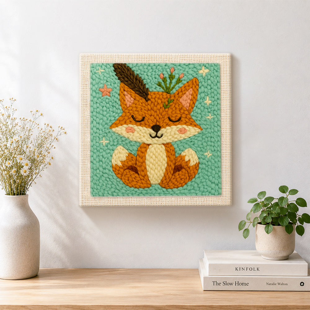 Finished cute fox with feathers and sprigs artwork displayed on a wall