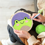 Creating handmade cute frog face punch needle artwork