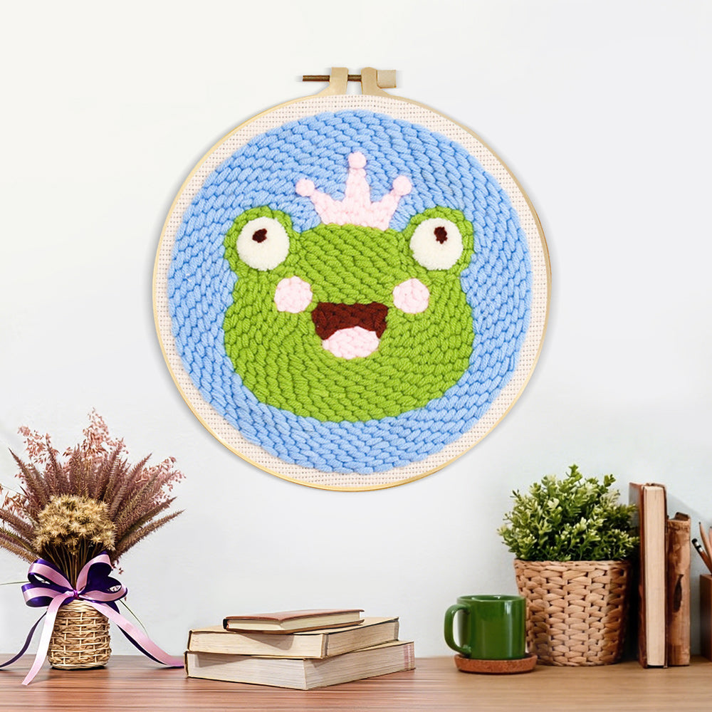Finished cute frog with crown artwork displayed on a wall