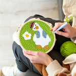 Creating handmade cute goose with daisy punch needle artwork