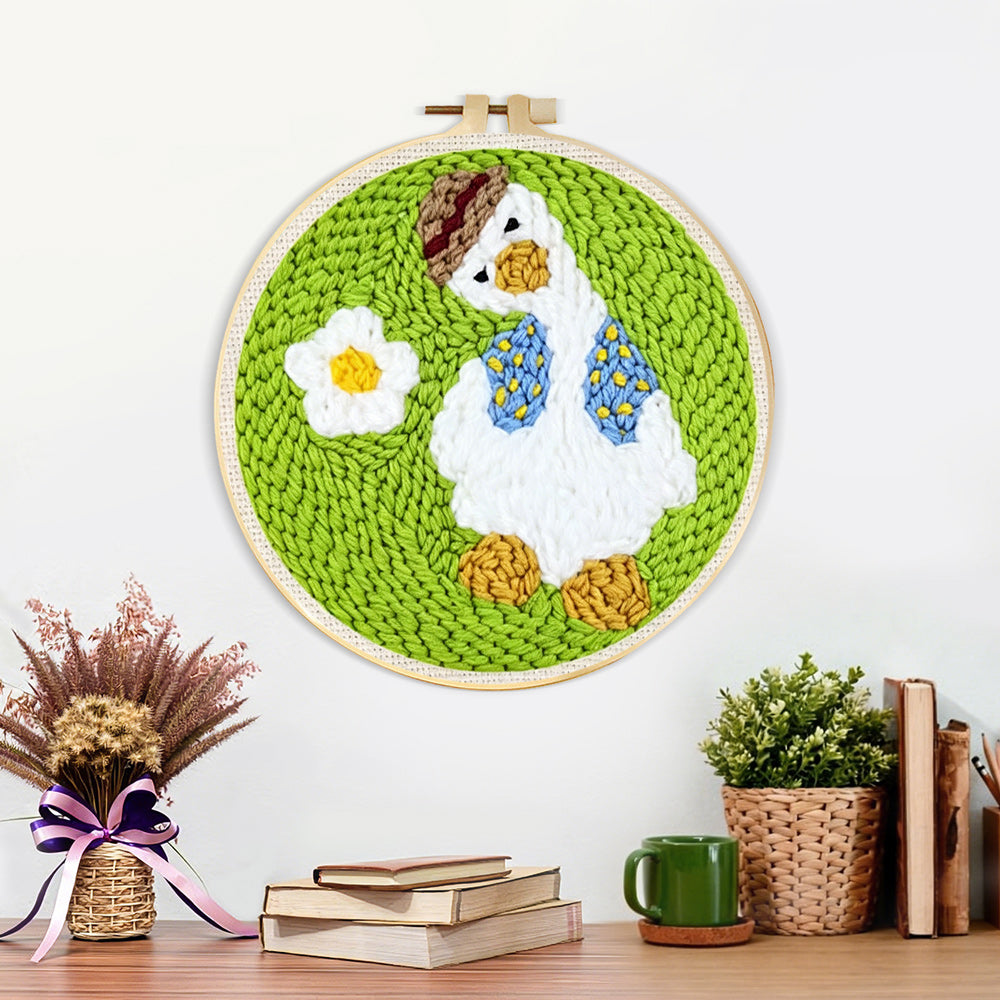 Finished cute goose with daisy artwork displayed on a wall