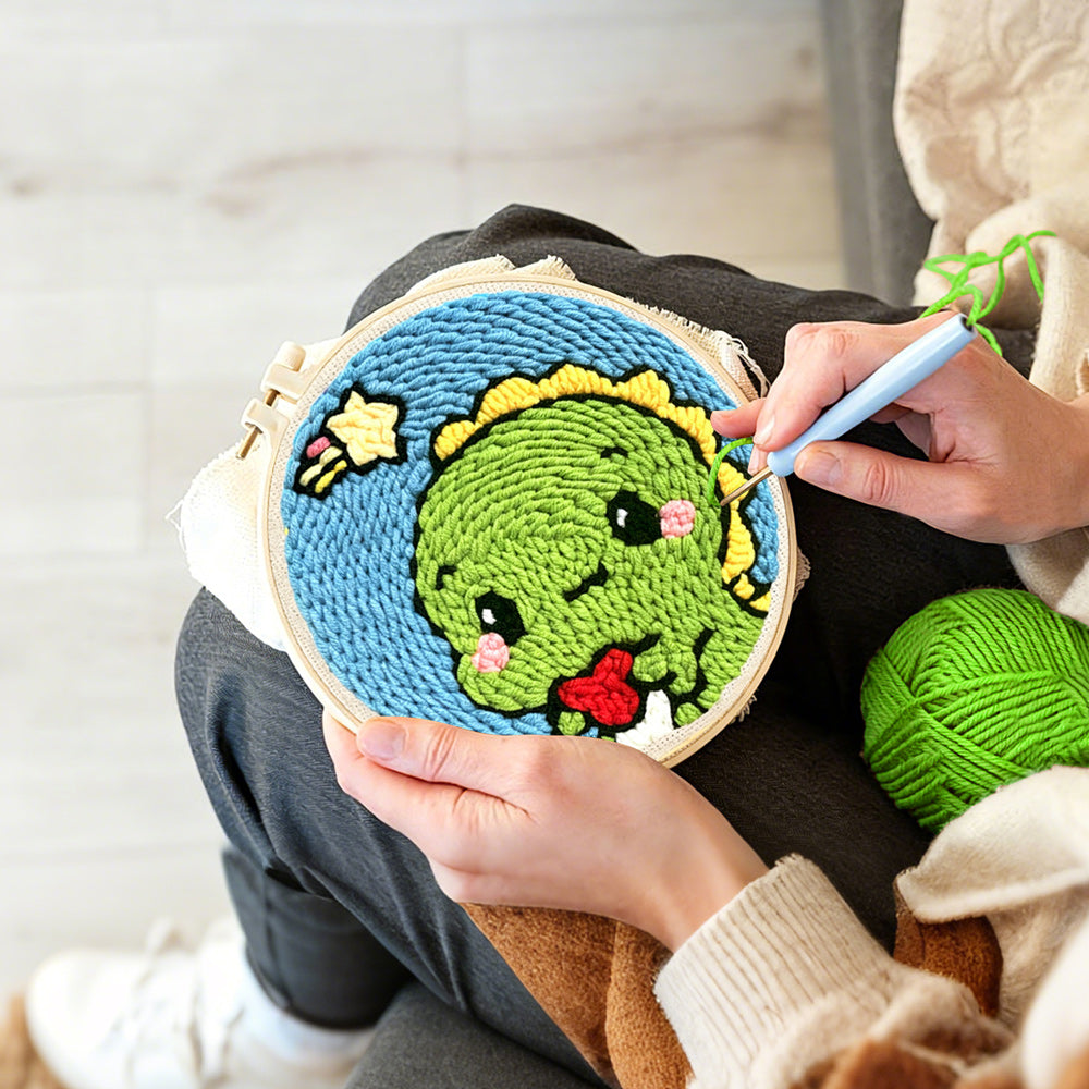 Creating handmade cute green baby dinosaur punch needle artwork