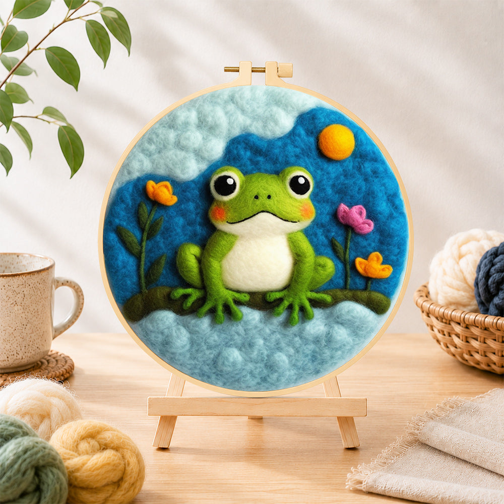 Finished cute green frog under the cloud needle felting displayed on a wooden easel