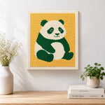 Finished cute green panda artwork displayed on a wall