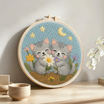 Cute grey kittens and wildflowers punch needle artwork displayed on a table