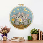 Finished cute grey kittens and wildflowers artwork displayed on a wall