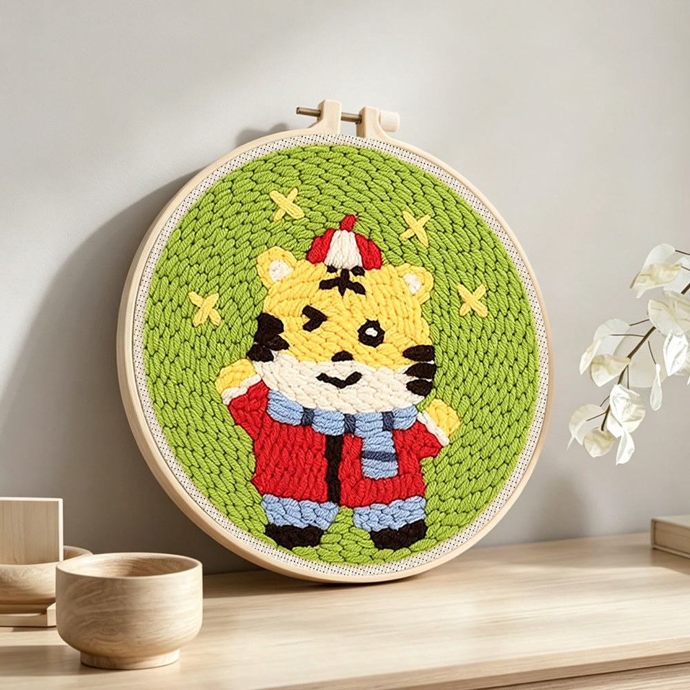 Cute happy tiger punch needle artwork displayed on a table