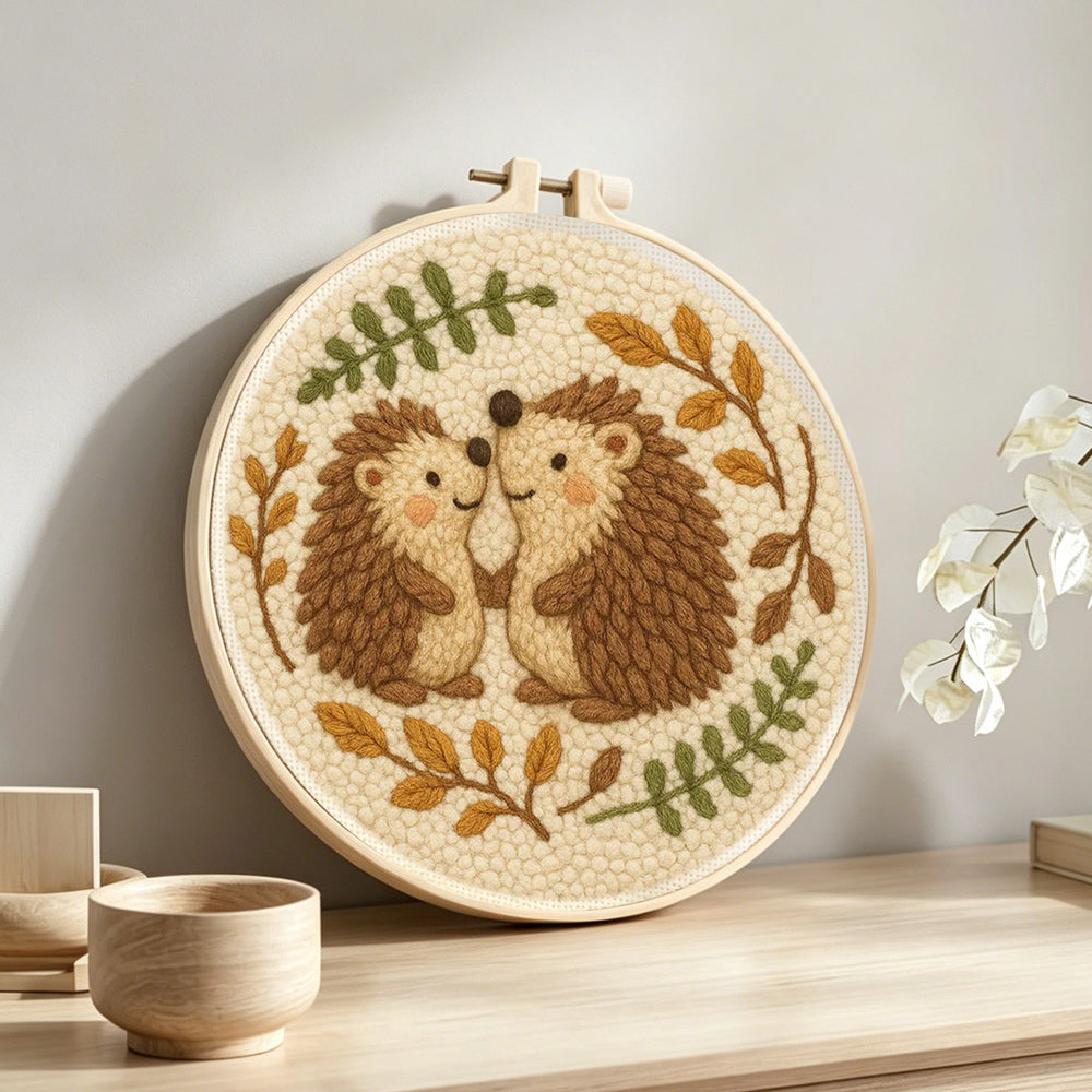 Cute hedgehog couple punch needle artwork displayed on a table