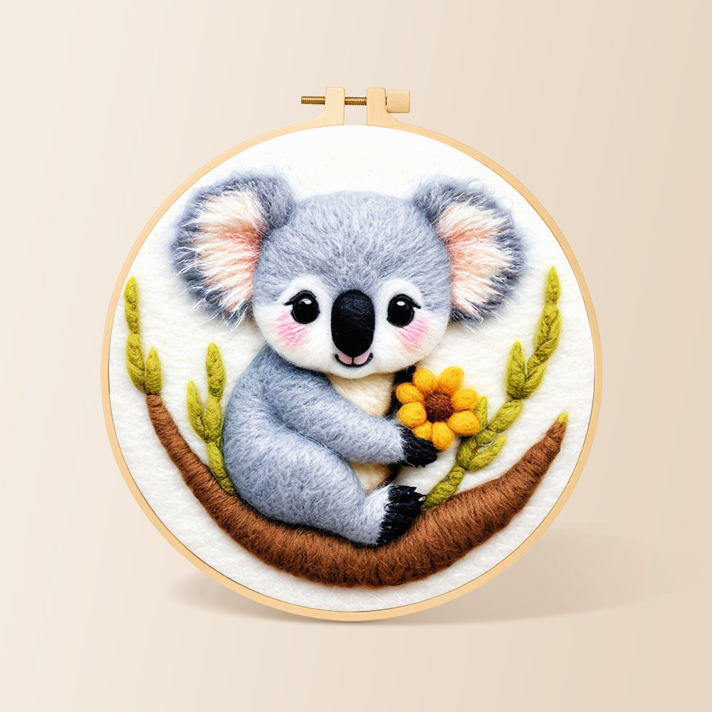 Cute koala holding a flower needle felting kit for beginners with a round wooden frame
