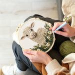 Creating handmade cute lamb in daisy field punch needle artwork
