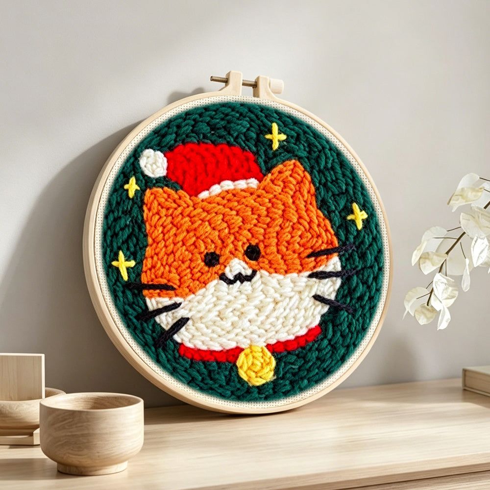 Finished cute orange cat in santa hat artwork displayed on a wall