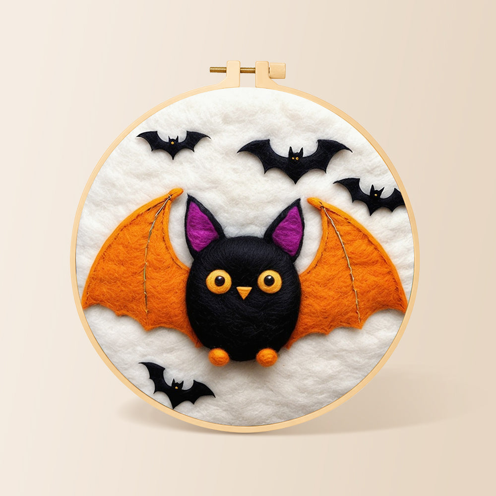 Cute orange-winged bat needle felting kit for beginners with a round wooden frame