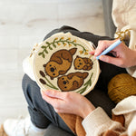 Creating handmade cute otter family punch needle artwork