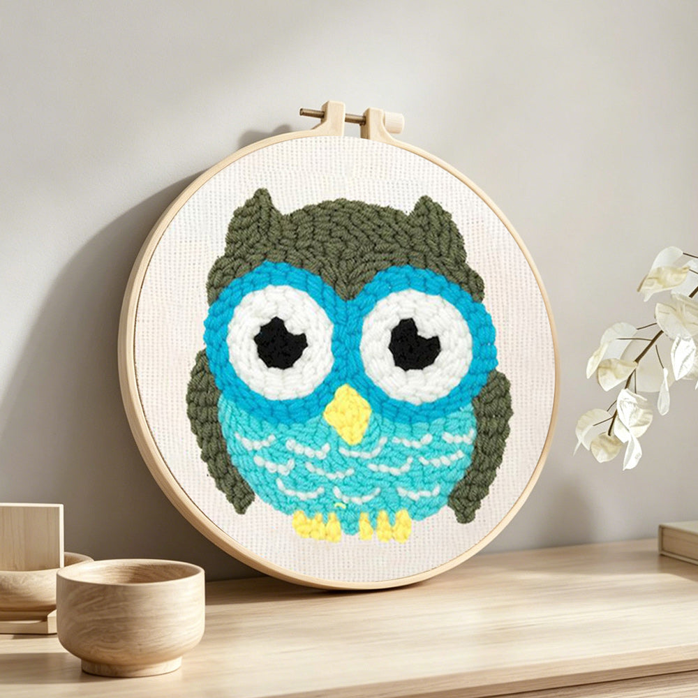 Cute owl punch needle artwork displayed on a table