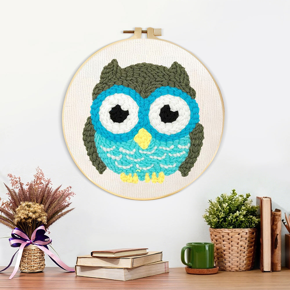 Finished cute owl artwork displayed on a wall