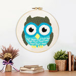 Finished cute owl artwork displayed on a wall