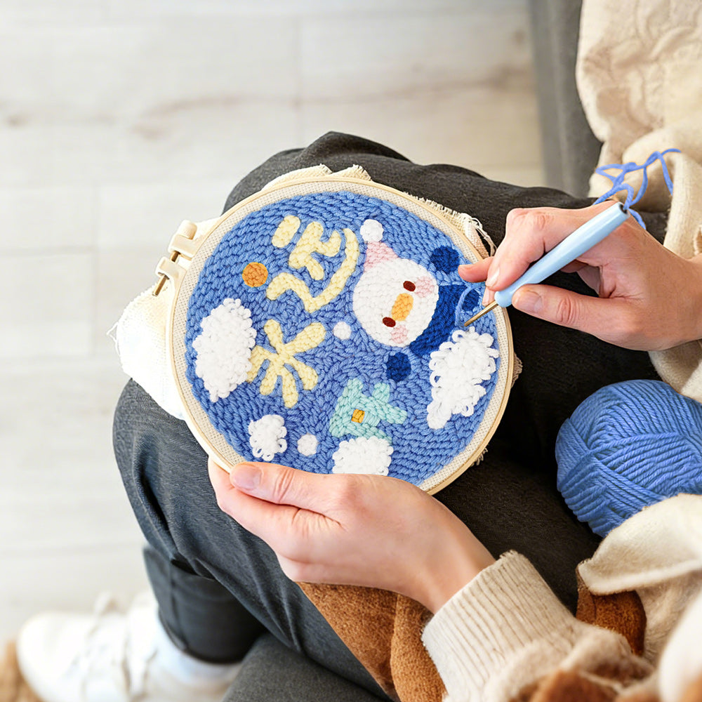 Creating handmade cute penguin with "always happy" text punch needle artwork