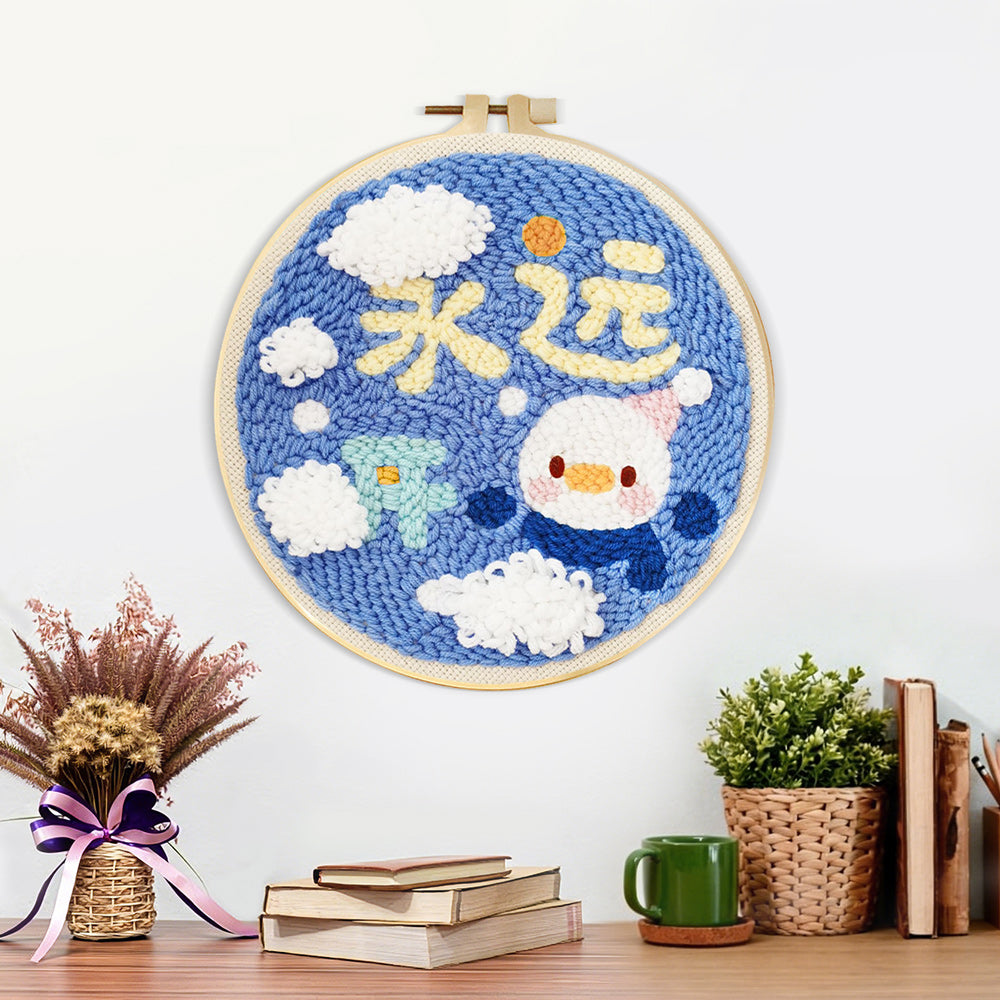 Finished cute penguin with "always happy" text artwork displayed on a wall