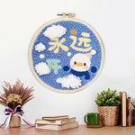 Finished cute penguin with "always happy" text artwork displayed on a wall