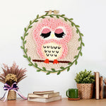 Finished cute pink owl artwork displayed on a wall