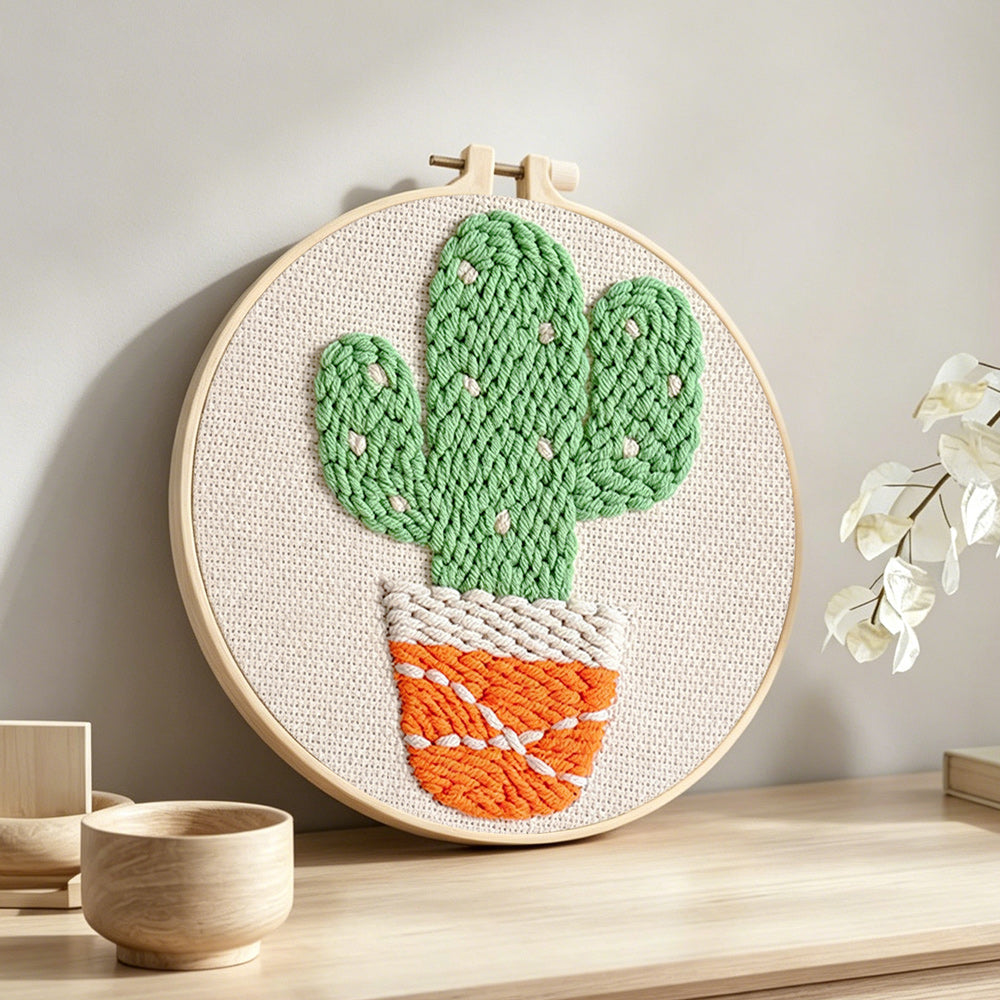 Cute potted twin cactus punch needle artwork displayed on a table