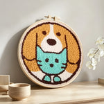 Cute puppy and cat punch needle artwork displayed on a table