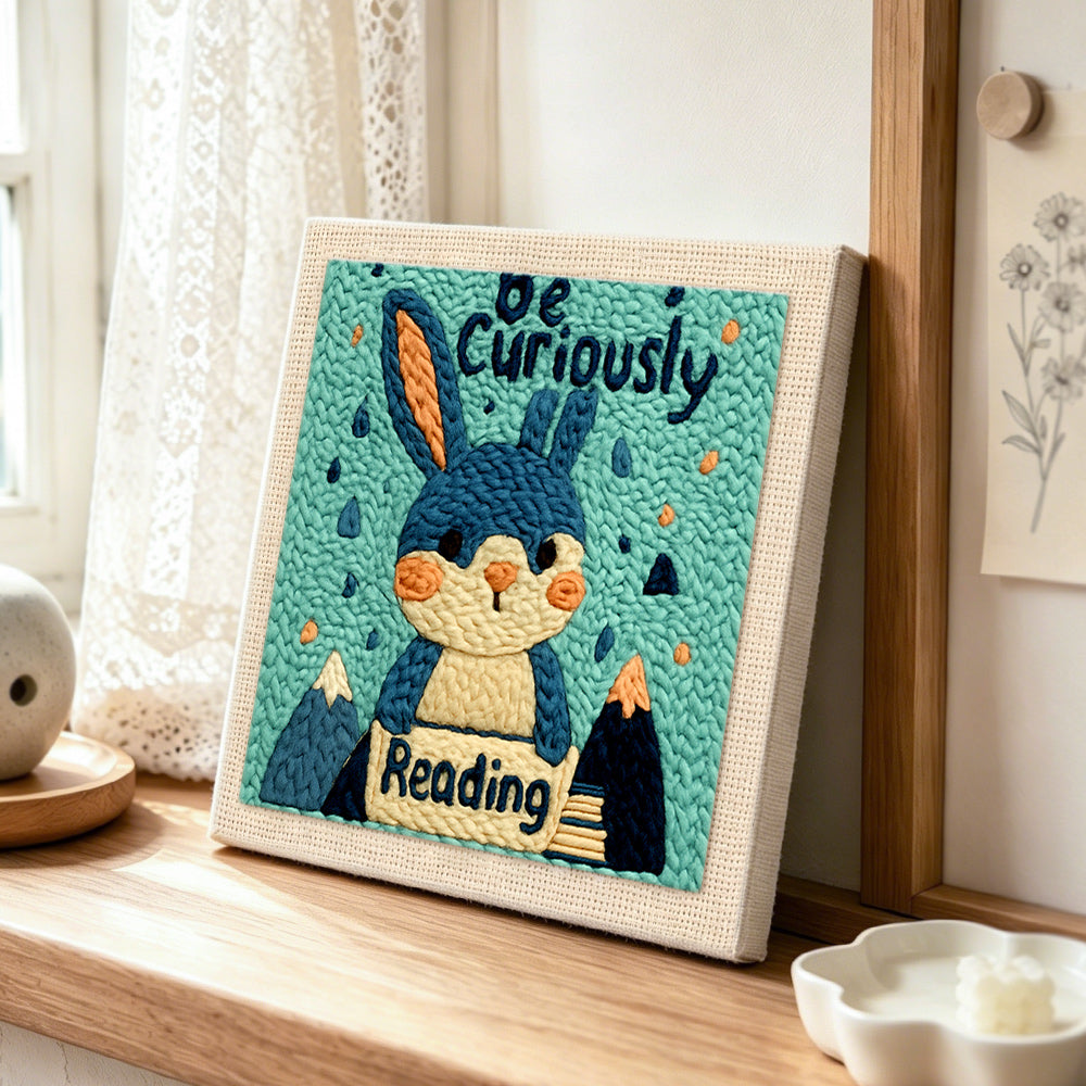 Cute reader bunny punch needle artwork displayed on a table