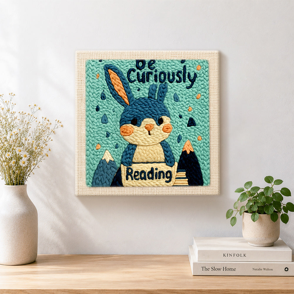 Finished cute reader bunny artwork displayed on a wall