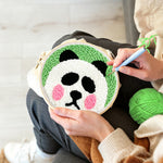 Creating handmade cute round panda punch needle artwork