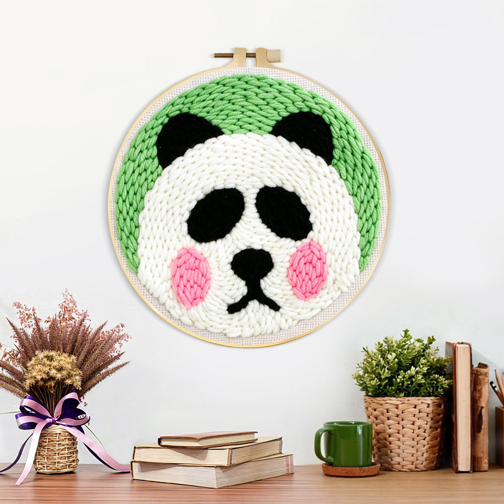 Finished cute round panda artwork displayed on a wall
