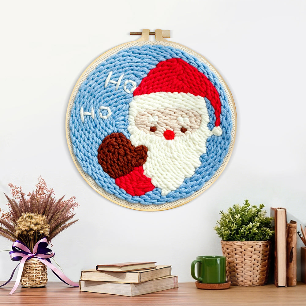 Finished cute santa claus “ho ho” artwork displayed on a wall