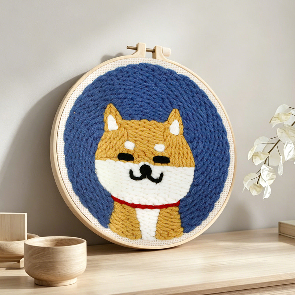 Cute shiba inu punch needle artwork displayed on a table