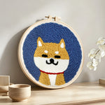 Cute shiba inu punch needle artwork displayed on a table