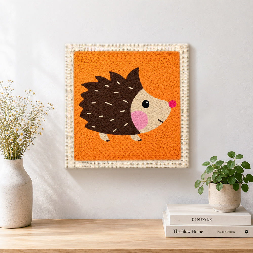 Finished cute side-profile hedgehog artwork displayed on a wall
