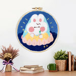 Finished cute sleeping cloud bunny artwork displayed on a wall