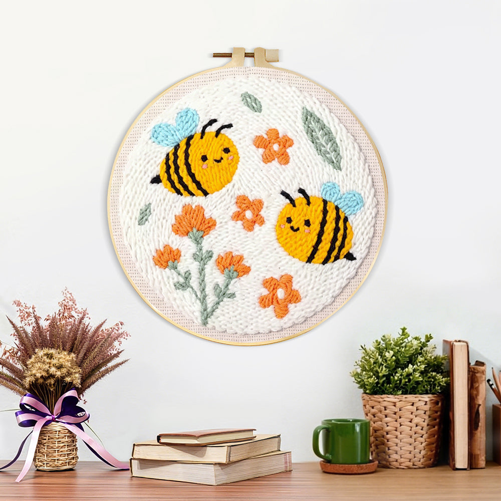 Finished cute smiling bumblebees and orange flowers artwork displayed on a wall