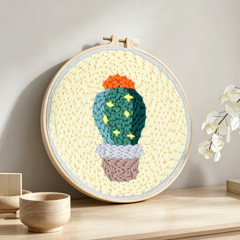Cute starry cactus punch needle artwork displayed on a table