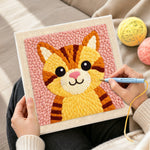 Creating handmade cute striped kitten with pink nose punch needle artwork