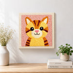 Finished cute striped kitten with pink nose artwork displayed on a wall