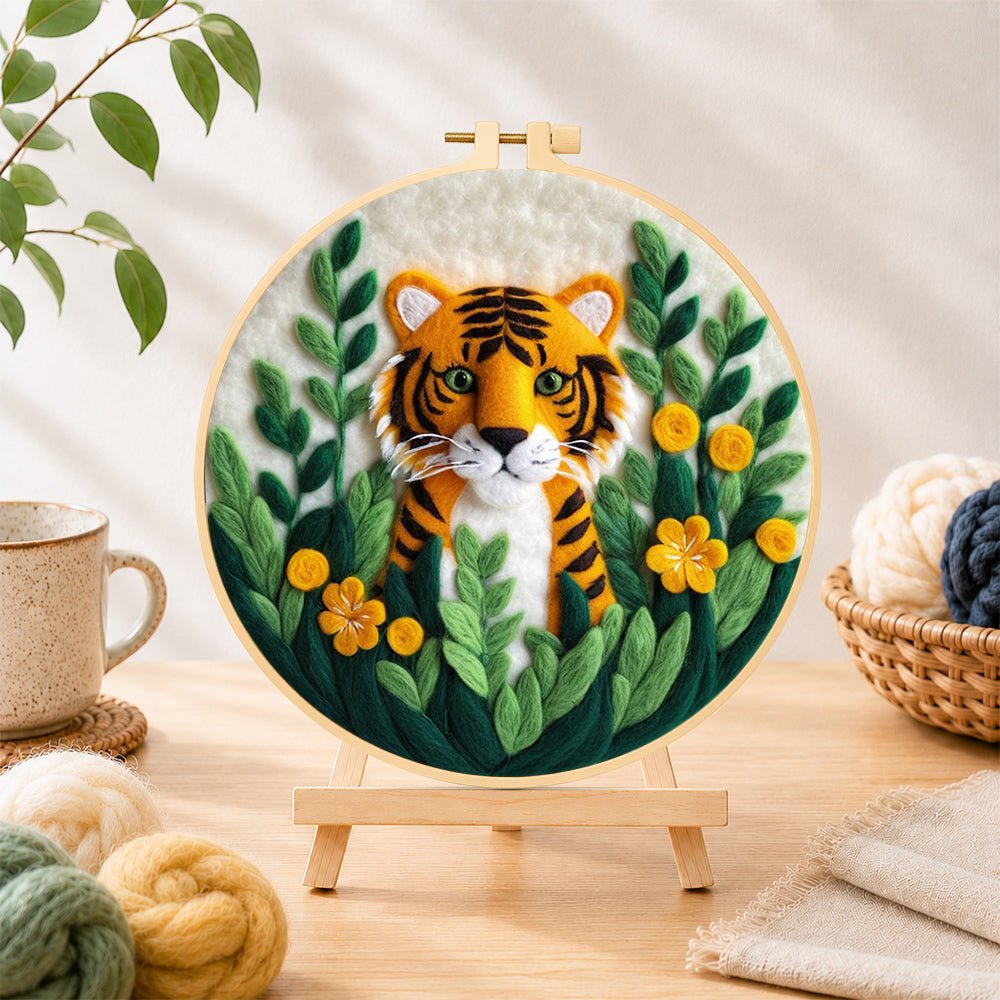 Finished cute tiger cub in the jungle needle felting displayed on a wooden easel