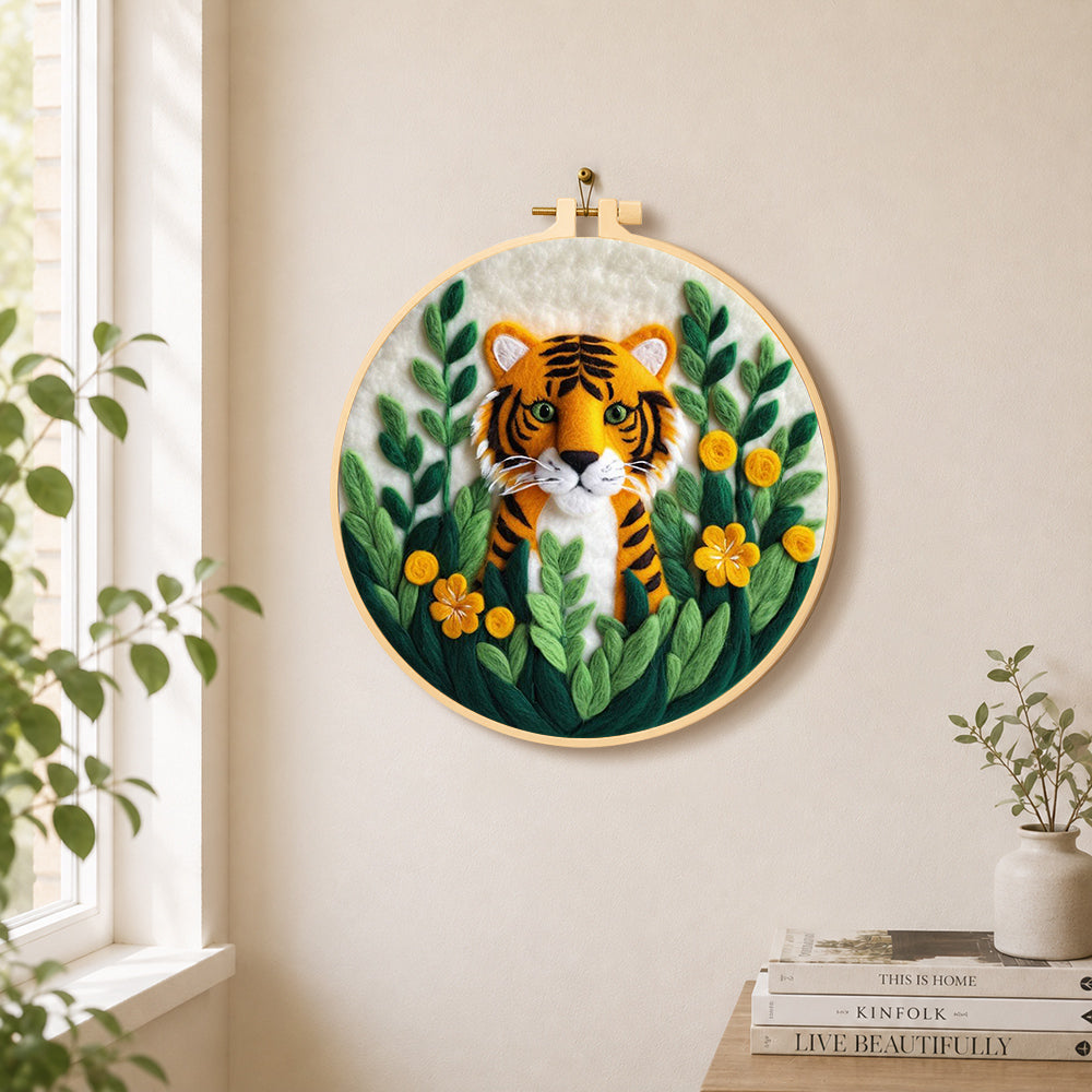 Cute tiger cub in the jungle needle felt wall art displayed in a bright home interior