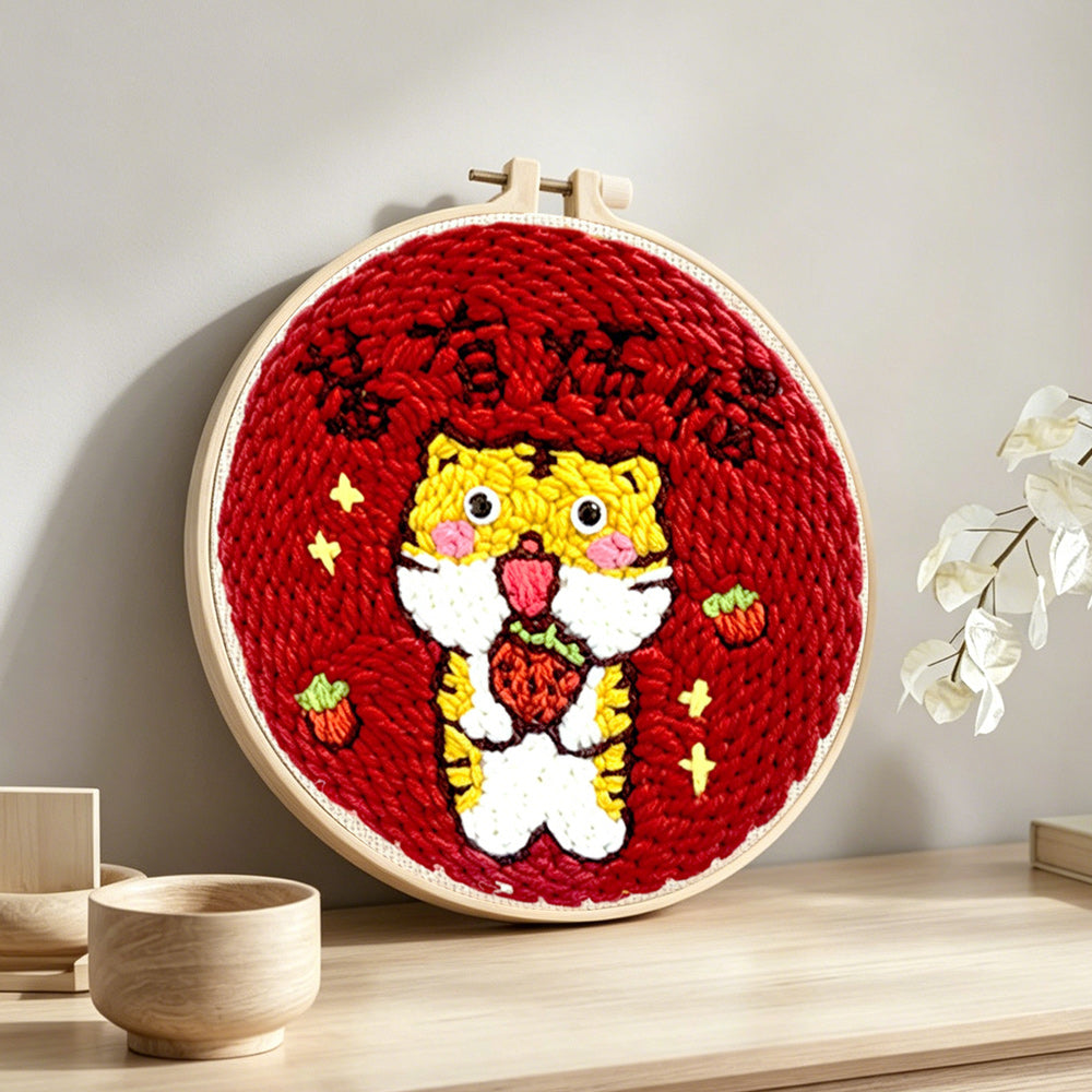 Cute tiger with "no worries" text punch needle artwork displayed on a table